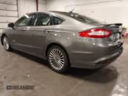 ✅ 2014 Ford Fusion Titanium Hybrid • VIN: 3FA6P0RU1ER217906 • Lot: 42563246. Listed on IAAI with 66,335 mi. Free auction sales archive from the USA and detailed vehicle history report at DreamBid. Image 3.
