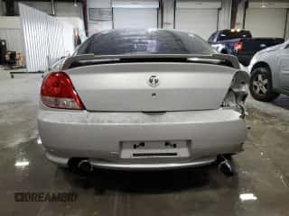 2006 Hyundai Tiburon GT z VIN KMHHN65F96U203924, wystawiony jako Copart lot #43624185 z przebiegiem 120 403 mil mil oraz Szkoda całkowita • Salvage title. Historia ofert i sprzedaży dostępna na DreamBid. Obrazek 6.