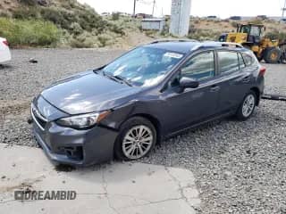 2018 Subaru Impreza Premium with VIN 4S3GTAB64J3715568, listed as a Copart auction lot 66916545 with 94,997 mi miles and Salvage title. Bid and sale history available at DreamBid. Image 1.