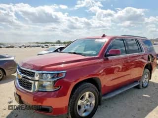 2015 Chevrolet Tahoe LS with VIN 1GNSCAKC7FR638223, listed as a Copart auction lot 83967245 with 171,068 mi miles and Salvage title. Bid and sale history available at DreamBid. Image 1.