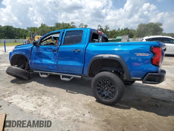 ✅ 2023 Chevrolet Colorado 4WD Trail Boss • VIN: 1GCPTEEK2P1208916 • Лот: 68089094. Опубликован ранее на Copart с пробегом Не указан. Бесплатный доступ к архиву аукционных продаж из США и подробный отчёт об истории автомобиля на DreamBid. Изображение 2.