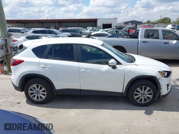 ✅ 2016 Mazda CX-5 Touring • VIN: JM3KE2CY0G0694939 • Lot: 43401057. Wystawiony na IAAI z przebiegiem 125 867 mil. Bezpłatny archiwum sprzedaży aukcyjnych z USA i szczegółowy raport historii pojazdu na DreamBid. Zdjęcie 13.