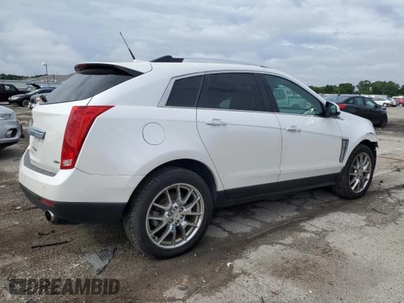 ✅ 2013 Cadillac SRX Performance Collection • VIN: 3GYFNHE36DS521908 • Lot: 65402415. Listed on Copart with 124,799 mi. Free auction sales archive from the USA and detailed vehicle history report at DreamBid. Image 3.
