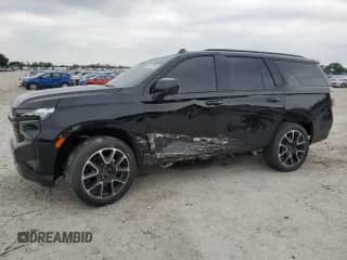 2023 Chevrolet Tahoe RST with VIN 1GNSKRKT1PR132227, listed as a Copart auction lot 57033255 with 30,133 mi miles and Salvage title. Bid and sale history available at DreamBid. Image 1.