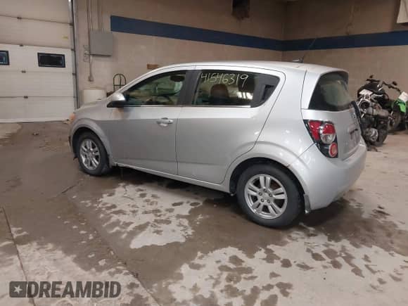 2013 Chevrolet Sonic LT with VIN 1G1JD6SH7D4203621, listed as a IAAI auction lot 41546319 with 201,164 mi miles and . Bid and sale history available at DreamBid. Image 3.