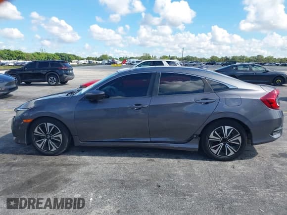 ✅ 2017 Honda Civic EX-T • VIN: 2HGFC1F34HH640486 • Lot: 43007728. Listed on IAAI with 132,879 mi. Free auction sales archive from the USA and detailed vehicle history report at DreamBid. Image 14.