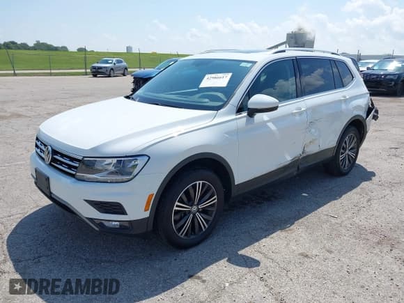✅ 2018 Volkswagen Tiguan SEL • VIN: 3VV2B7AX4JM204453 • Lot: 42986617. Listed on IAAI with 89,929 mi. Free auction sales archive from the USA and detailed vehicle history report at DreamBid. Image 2.