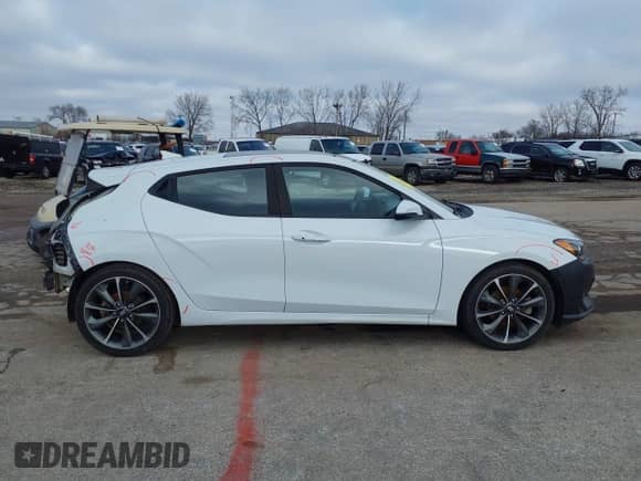 2019 Hyundai Veloster Premium z VIN KMHTG6AF8KU003038, wystawiony jako IAAI lot #41118865 z przebiegiem 65 014 mil mil oraz . Historia ofert i sprzedaży dostępna na DreamBid. Obrazek 13.