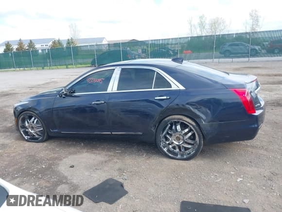 ✅ 2015 Cadillac CTS Luxury AWD • VIN: 1G6AX5SX5F0119102 • Lot: 42231015. Listed on IAAI with 106,643 mi. Free auction sales archive from the USA and detailed vehicle history report at DreamBid. Image 14.