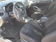 ✅ 2013 Hyundai Veloster w/Black Int • VIN: KMHTC6AD4DU088389 • Lot: 87206334. Wystawiony na Copart z przebiegiem 140 259 mil. Bezpłatny archiwum sprzedaży aukcyjnych z USA i szczegółowy raport historii pojazdu na DreamBid. Zdjęcie 7.