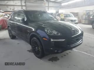 ✅ 2016 Porsche Cayenne S E-Hybrid • VIN: WP1AE2A24GLA17473 • Lot: 43539476. Listed on IAAI with 138,878 mi. Free auction sales archive from the USA and detailed vehicle history report at DreamBid. Image 1.