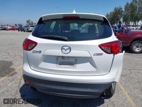 ✅ 2016 Mazda CX-5 Sport • VIN: JM3KE2BY5G0793032 • Lot: 42128706. Listed on IAAI with 52,010 mi. Free auction sales archive from the USA and detailed vehicle history report at DreamBid. Image 16.