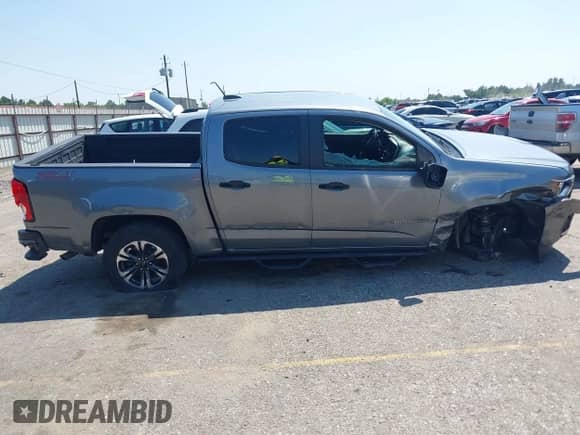 ✅ 2021 Chevrolet Colorado 2WD Z71 • VIN: 1GCGSDEN7M1221860 • Лот: 43174109. Опубликован ранее на IAAI с пробегом 107 061 миль. Бесплатный доступ к архиву аукционных продаж из США и подробный отчёт об истории автомобиля на DreamBid. Изображение 14.