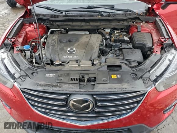 ✅ 2016 Mazda CX-5 Grand Touring • VIN: JM3KE2DY8G0707922 • Lot: 95433775. Wystawiony na Copart z przebiegiem 43 874 mil. Bezpłatny archiwum sprzedaży aukcyjnych z USA i szczegółowy raport historii pojazdu na DreamBid. Zdjęcie 12.