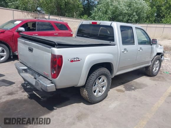 ✅ 2012 GMC Canyon SLE1 • VIN: 1GTH6MFE3C8127620 • Lot: 42488957. Listed on IAAI with 92,593 mi. Free auction sales archive from the USA and detailed vehicle history report at DreamBid. Image 4.