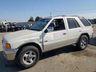 ✅ 1996 Isuzu Rodeo • VIN: 4S2CK58V3T4304736 • Lot: 76058144. Listed on Copart with 125,543 mi. Free auction sales archive from the USA and detailed vehicle history report at DreamBid. Image 1.