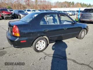 2005 Hyundai Accent GLS with VIN KMHCG45C15U662362, listed as a Copart auction lot 80574774 with 122,898 mi miles and Salvage title. Bid and sale history available at DreamBid. Image 3.