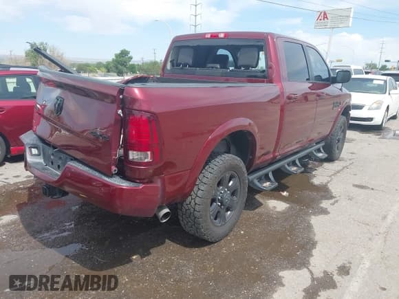 ✅ 2016 Ram 2500 Laramie • VIN: 3C6UR5FL0GG230494 • Lot: 42461410. Listed on IAAI with 96,128 mi. Free auction sales archive from the USA and detailed vehicle history report at DreamBid. Image 4.