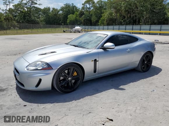 ✅ 2011 Jaguar XK XKR • VIN: SAJWA4DC3BMB42457 • Lot: 61157735. Listed on Copart with 128,452 mi. Free auction sales archive from the USA and detailed vehicle history report at DreamBid. Image 1.