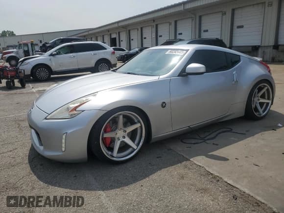 ✅ 2014 Nissan 370Z • VIN: JN1AZ4EH0EM633259 • Lot: 60282445. Listed on Copart with 107,351 mi. Free auction sales archive from the USA and detailed vehicle history report at DreamBid. Image 1.