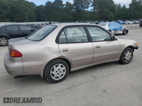 ✅ 1999 Toyota Corolla LE • VIN: 1NXBR12E6XZ148570 • Лот: 81554415. Опубликован ранее на Copart с пробегом 264 960 миль. Бесплатный доступ к архиву аукционных продаж из США и подробный отчёт об истории автомобиля на DreamBid. Изображение 3.