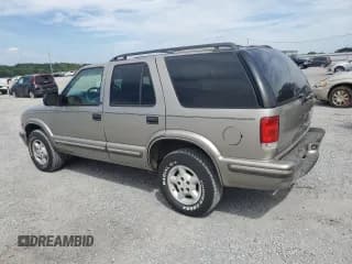 ✅ 1999 Chevrolet Blazer LS • VIN: 1GNDT13W7X2168500 • Lot: 70659475. Wystawiony na Copart z przebiegiem 130 002 mil. Bezpłatny archiwum sprzedaży aukcyjnych z USA i szczegółowy raport historii pojazdu na DreamBid. Zdjęcie 2.