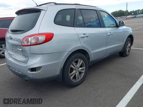 2010 Hyundai Santa Fe Limited with VIN 5NMSKDAG4AH341859, listed as a IAAI auction lot 43487646 with 169,452 mi miles and . Bid and sale history available at DreamBid. Image 4.