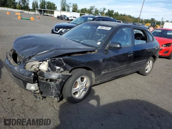 2003 Hyundai Elantra GT z VIN KMHDN55DX3U097387, wystawiony jako Copart lot #70857924 z przebiegiem 142 100 mil mil oraz Szkoda całkowita • Salvage title. Historia ofert i sprzedaży dostępna na DreamBid. Obrazek 1.