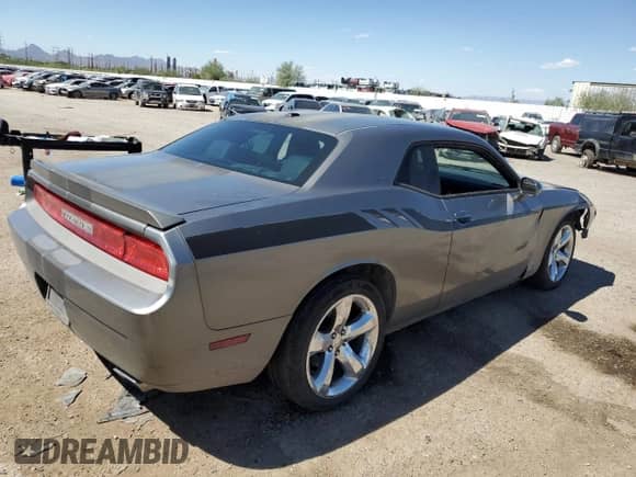 2012 Dodge Challenger SXT z VIN 2C3CDYAG4CH153576, wystawiony jako Copart lot #71494414 z przebiegiem 139 650 mil mil oraz Szkoda całkowita • Salvage title. Historia ofert i sprzedaży dostępna na DreamBid. Obrazek 3.