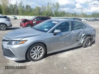 2021 Toyota Camry LE with VIN 4T1C11BK6MU025946, listed as a Copart auction lot 71301635 with 76,399 mi miles and Salvage title. Bid and sale history available at DreamBid. Image 1.