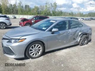 ✅ 2021 Toyota Camry LE • VIN: 4T1C11BK6MU025946 • Lot: 71301635. Listed on Copart with 76,399 mi. Free auction sales archive from the USA and detailed vehicle history report at DreamBid. Image 1.