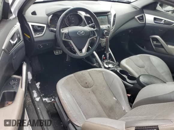 2012 Hyundai Veloster w/Red Int z VIN KMHTC6AD5CU030340, wystawiony jako Copart lot #45793405 z przebiegiem 139 667 mil mil oraz Czysty tytuł • Clean title. Historia ofert i sprzedaży dostępna na DreamBid. Obrazek 8.