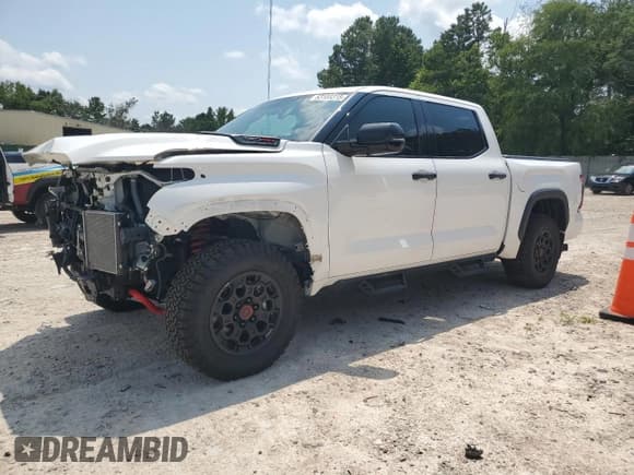 ✅ 2023 Toyota Tundra TRD Pro Hybrid • VIN: 5TFPC5DB8PX026040 • Lot: 63108315. Listed on Copart with 30,920 mi. Free auction sales archive from the USA and detailed vehicle history report at DreamBid. Image 1.