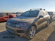 ✅ 2014 Volkswagen Touareg Exec • VIN: WVGEP9BP7ED012951 • Лот: 85498755. Опубликован ранее на Copart с пробегом 150 764 миль. Бесплатный доступ к архиву аукционных продаж из США и подробный отчёт об истории автомобиля на DreamBid. Изображение 1.