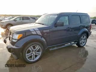 2011 Dodge Nitro Shock z VIN 1D4PT7GX9BW576481, wystawiony jako Copart lot #49848955 z przebiegiem 156 015 mil mil oraz Szkoda całkowita • Salvage title. Historia ofert i sprzedaży dostępna na DreamBid. Obrazek 1.