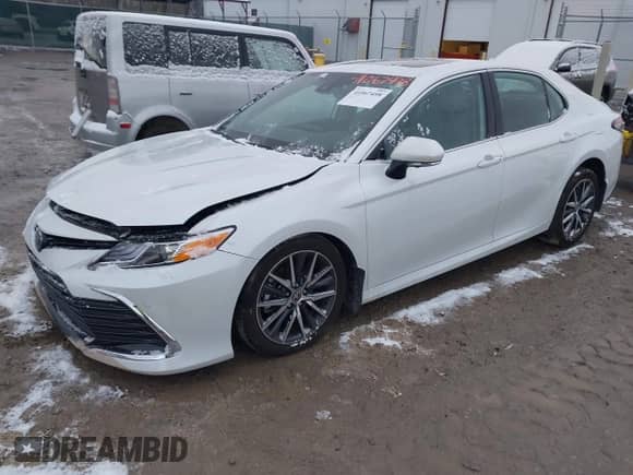 2022 Toyota Camry Hybrid XLE with VIN 4T1F31AK8NU575434, listed as a IAAI auction lot 41067498 with 11,052 mi miles and . Bid and sale history available at DreamBid. Image 2.