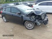 ✅ 2014 Ford Focus Titanium • VIN: 1FADP3N25EL194433 • Lot: 42512912. Listed on IAAI with 105,355 mi. Free auction sales archive from the USA and detailed vehicle history report at DreamBid. Image 1.