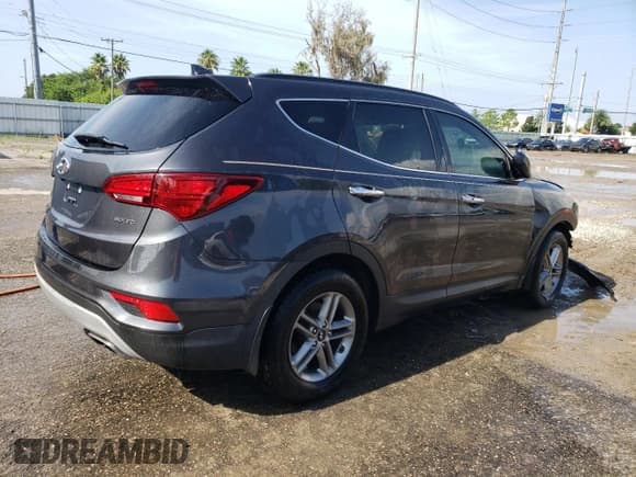 ✅ 2018 Hyundai Santa Fe 2.4L • VIN: 5XYZU3LB8JG542243 • Лот: 66616564. Опубликован ранее на Copart с пробегом 91 926 миль. Бесплатный доступ к архиву аукционных продаж из США и подробный отчёт об истории автомобиля на DreamBid. Изображение 3.