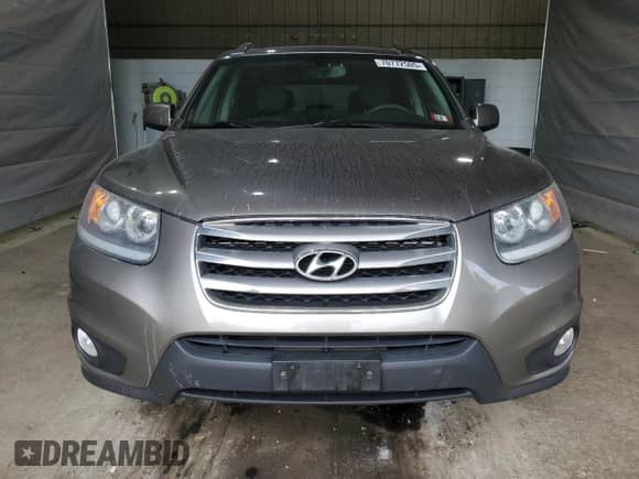 2012 Hyundai Santa Fe Limited с VIN 5XYZKDAG5CG144226, выставлен на аукционе Copart как лот 70772505 с пробегом 176 332 миль миль и Списание • Salvage title. История ставок и продаж доступна на DreamBid. Изображение 5.