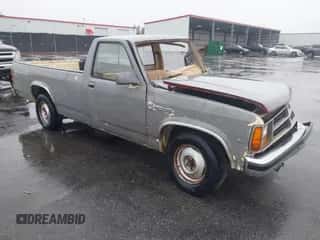 1987 Dodge Dakota z VIN 1B7GN14M0HS416892, wystawiony jako IAAI lot #41751330 z przebiegiem 102 958 mil mil oraz . Historia ofert i sprzedaży dostępna na DreamBid. Obrazek 1.
