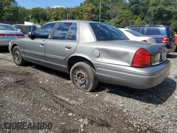 ✅ 2003 Ford Crown Victoria Standard • VIN: 2FAFP73W03X162382 • Lot: 71672805. Listed on Copart with 214,296 mi. Free auction sales archive from the USA and detailed vehicle history report at DreamBid. Image 2.