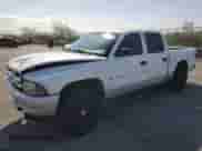 2002 Dodge Dakota SLT z VIN 1B7HL48X82S661284, wystawiony jako Copart lot #59824025 z przebiegiem 187 222 mil mil oraz Szkoda całkowita • Salvage title. Historia ofert i sprzedaży dostępna na DreamBid. Obrazek 1.