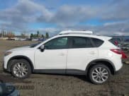 ✅ 2015 Mazda CX-5 Grand Touring • VIN: JM3KE4DY6F0495189 • Lot: 43848467. Listed on IAAI with 203,610 mi. Free auction sales archive from the USA and detailed vehicle history report at DreamBid. Image 14.