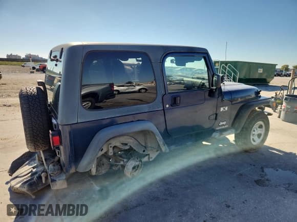 ✅ 2003 Jeep Wrangler X • VIN: 1J4FA39S23P305812 • Lot: 91579275. Listed on Copart with 125,744 mi. Free auction sales archive from the USA and detailed vehicle history report at DreamBid. Image 3.