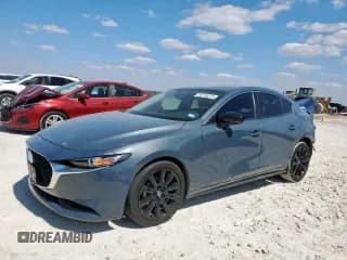 ✅ 2022 Mazda 3 Carbon Edition • VIN: 3MZBPACL1NM318792 • Lot: 82146275. Listed on Copart with 85,458 mi. Free auction sales archive from the USA and detailed vehicle history report at DreamBid. Image 1.