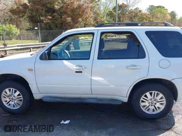 2005 Mercury Mariner Luxury z VIN 4M2CU56165DJ21267, wystawiony jako IAAI lot #41934003 z przebiegiem Nie podano mil oraz . Historia ofert i sprzedaży dostępna na DreamBid. Obrazek 13.