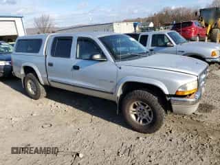 2001 Dodge Dakota Sport z VIN 1B7HG2AXX1S251376, wystawiony jako Copart lot #77015144 z przebiegiem 163 751 mil mil oraz Szkoda całkowita • Salvage title. Historia ofert i sprzedaży dostępna na DreamBid. Obrazek 4.