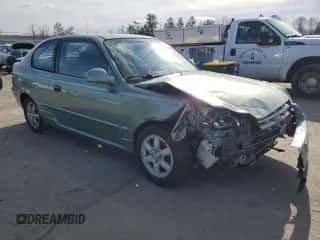 2003 Hyundai Accent GL with VIN KMHCG35CX3U242820, listed as a Copart auction lot 45971325 with 132,192 mi miles and Salvage title. Bid and sale history available at DreamBid. Image 4.