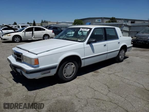✅ 1989 Dodge Dynasty • VIN: 1B3BC463XKD594439 • Lot: 65792195. Listed on Copart with 61,970 mi. Free auction sales archive from the USA and detailed vehicle history report at DreamBid. Image 1.