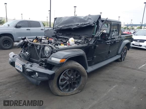 ✅ 2023 Jeep Gladiator Overland • VIN: 1C6HJTFG1PL562849 • Lot: 42076164. Listed on IAAI with 24,942 mi. Free auction sales archive from the USA and detailed vehicle history report at DreamBid. Image 2.